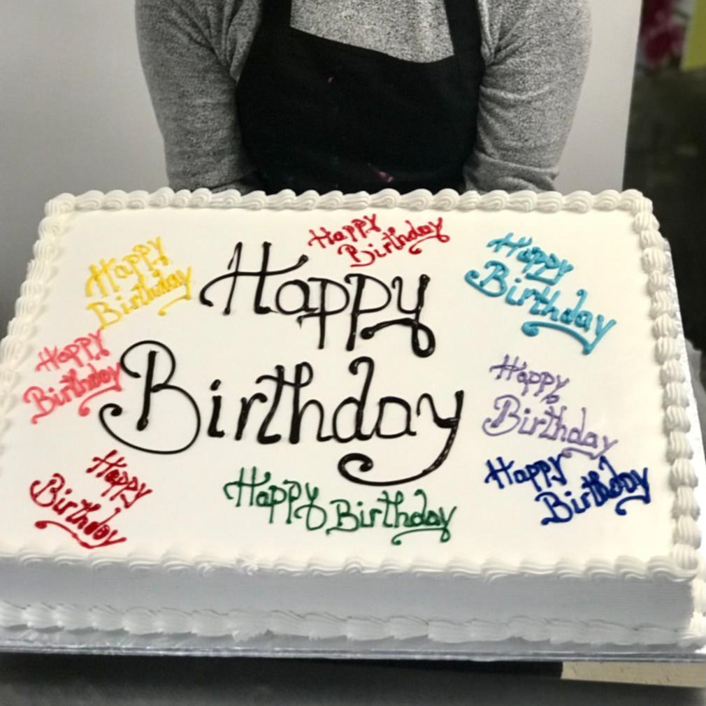 White sheet cake with happy birthday on it