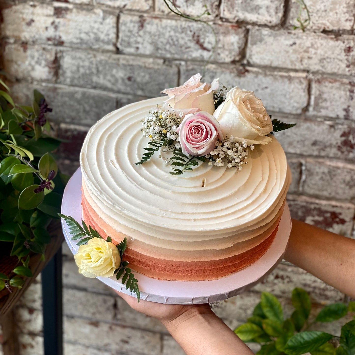 White cake with fresh flowers
