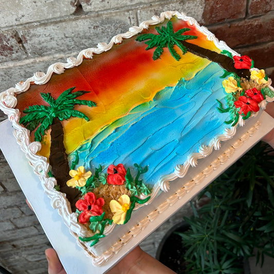 Beach ocean sunset themed cake