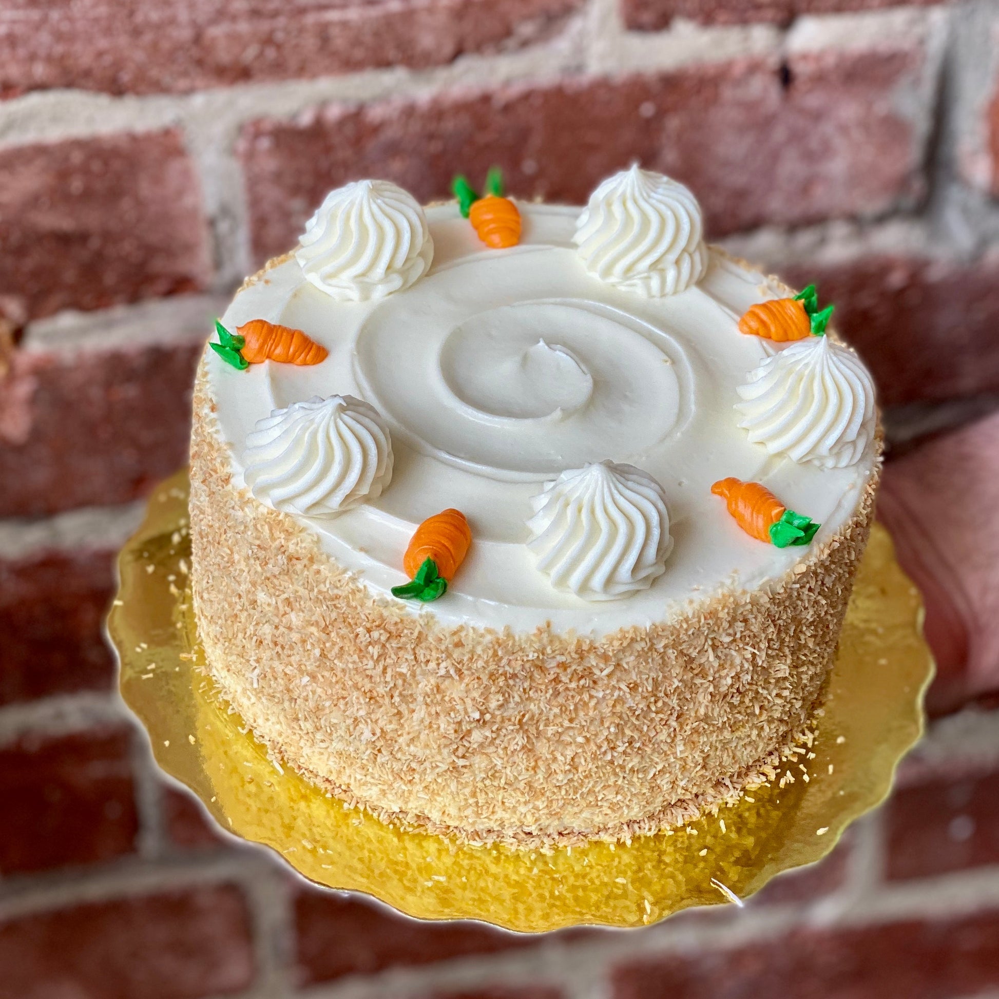 White cake with tiny carrot designs