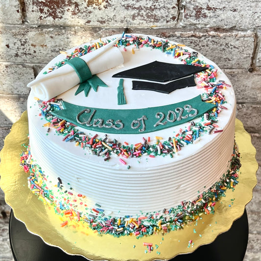 Graduation themed cake with fondant scroll and sprinkles