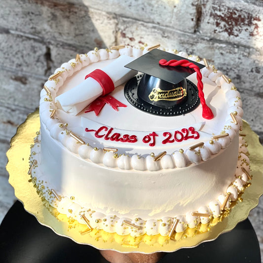 Graduation themed cake with fondant scroll