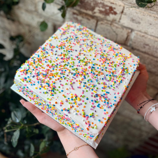 Square white cake with confetti sprinkles