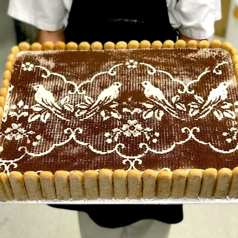 Tiramisu sheet cake with bird art