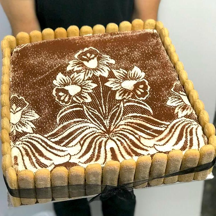Tiramisu sheet cake with flower art