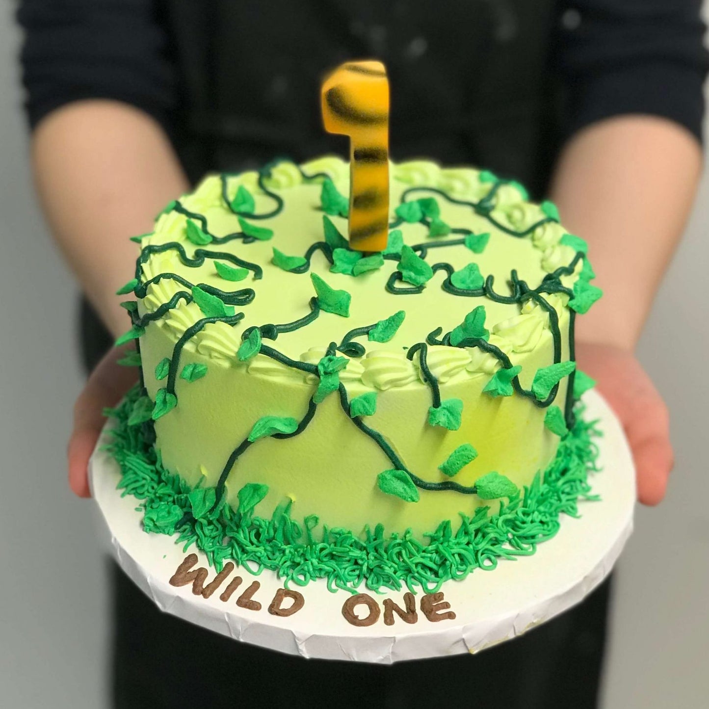 Birthday cake with vines on cake and a tiger number
