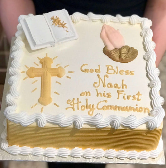 White and gold cake with religious theme