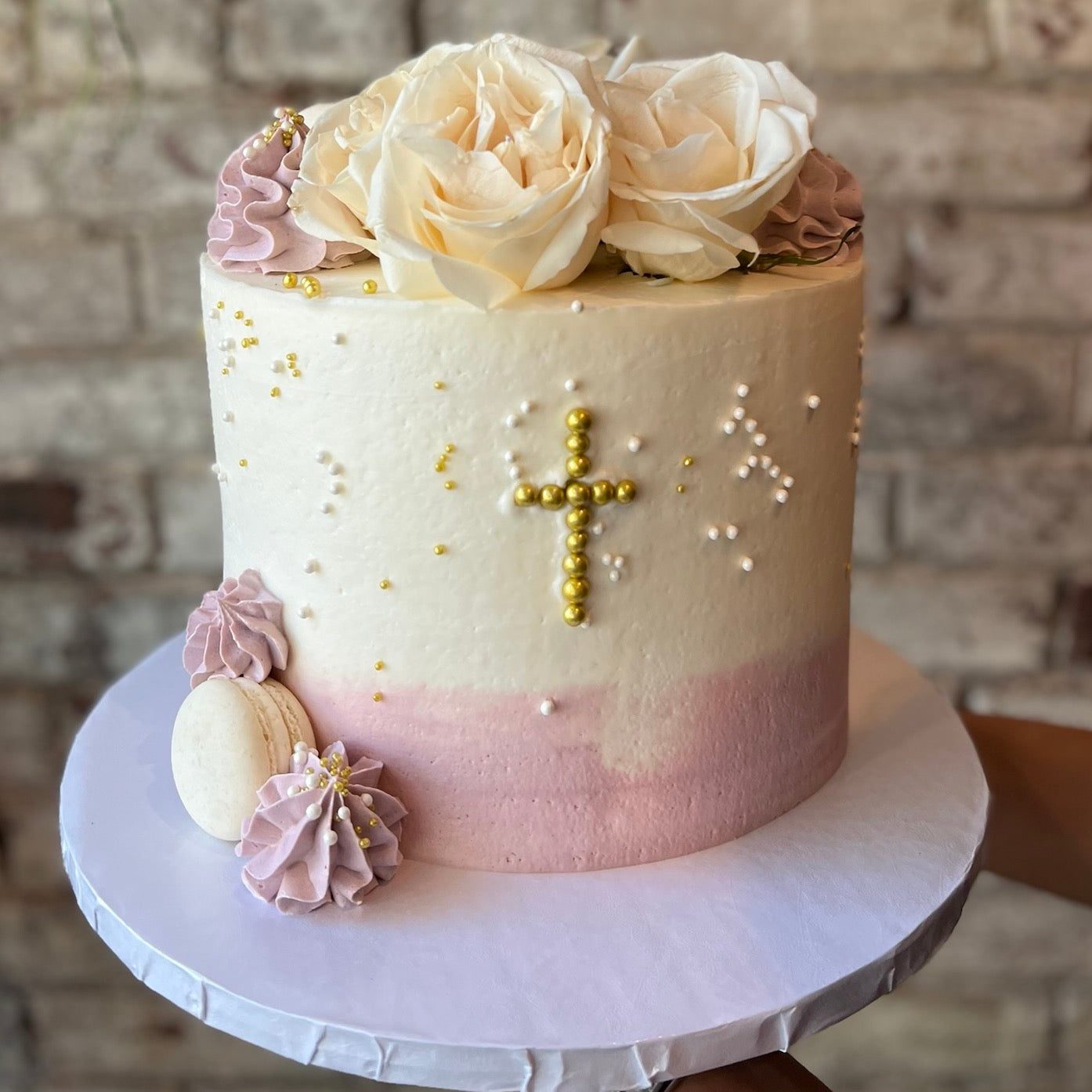 Communion cake with fresh flowers on top