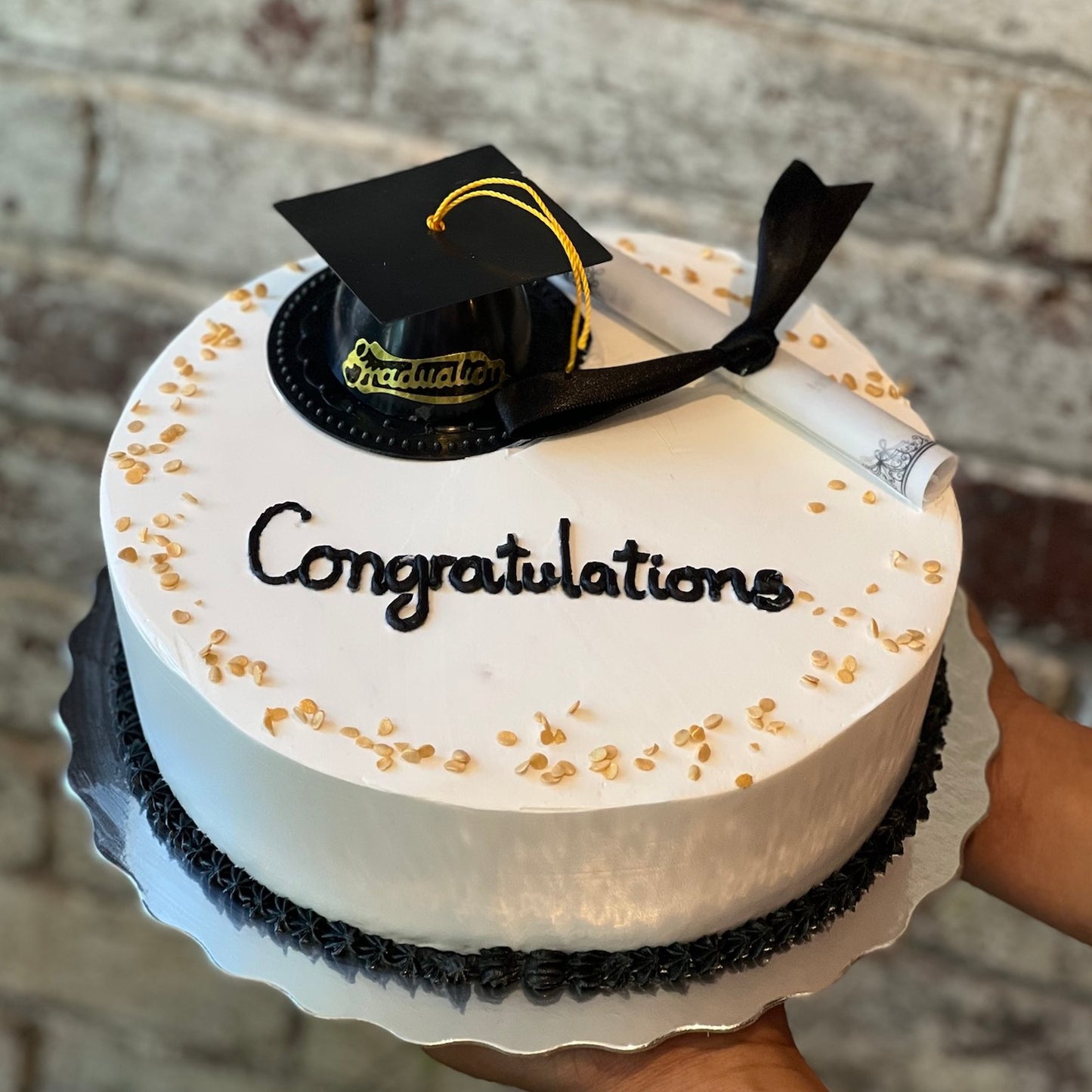 Graduation themed cake with cap and scroll