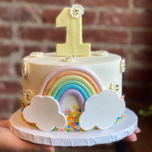 Pastel rainbow cake for child's birthday