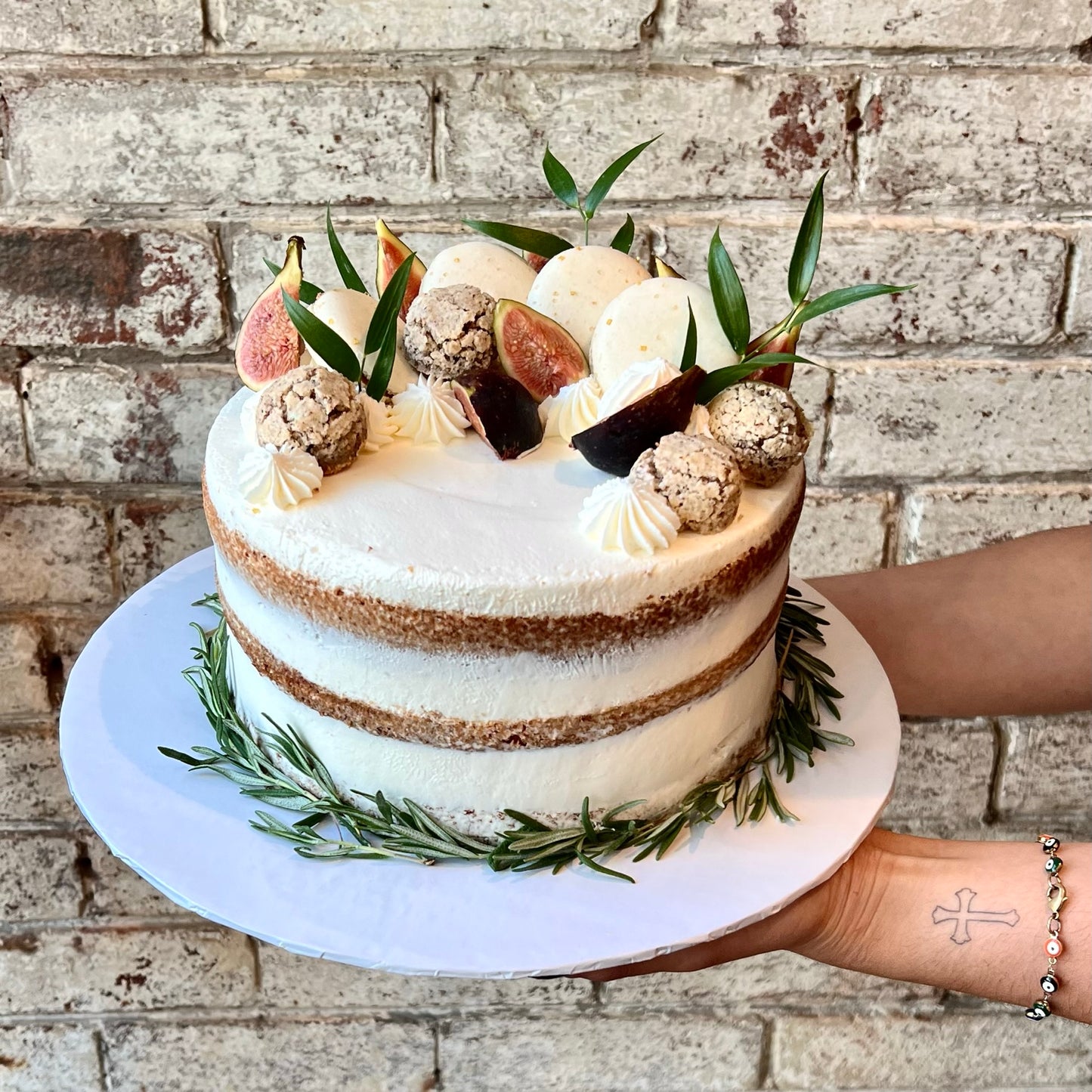 White cake with figs, macarons and amaretti cookies