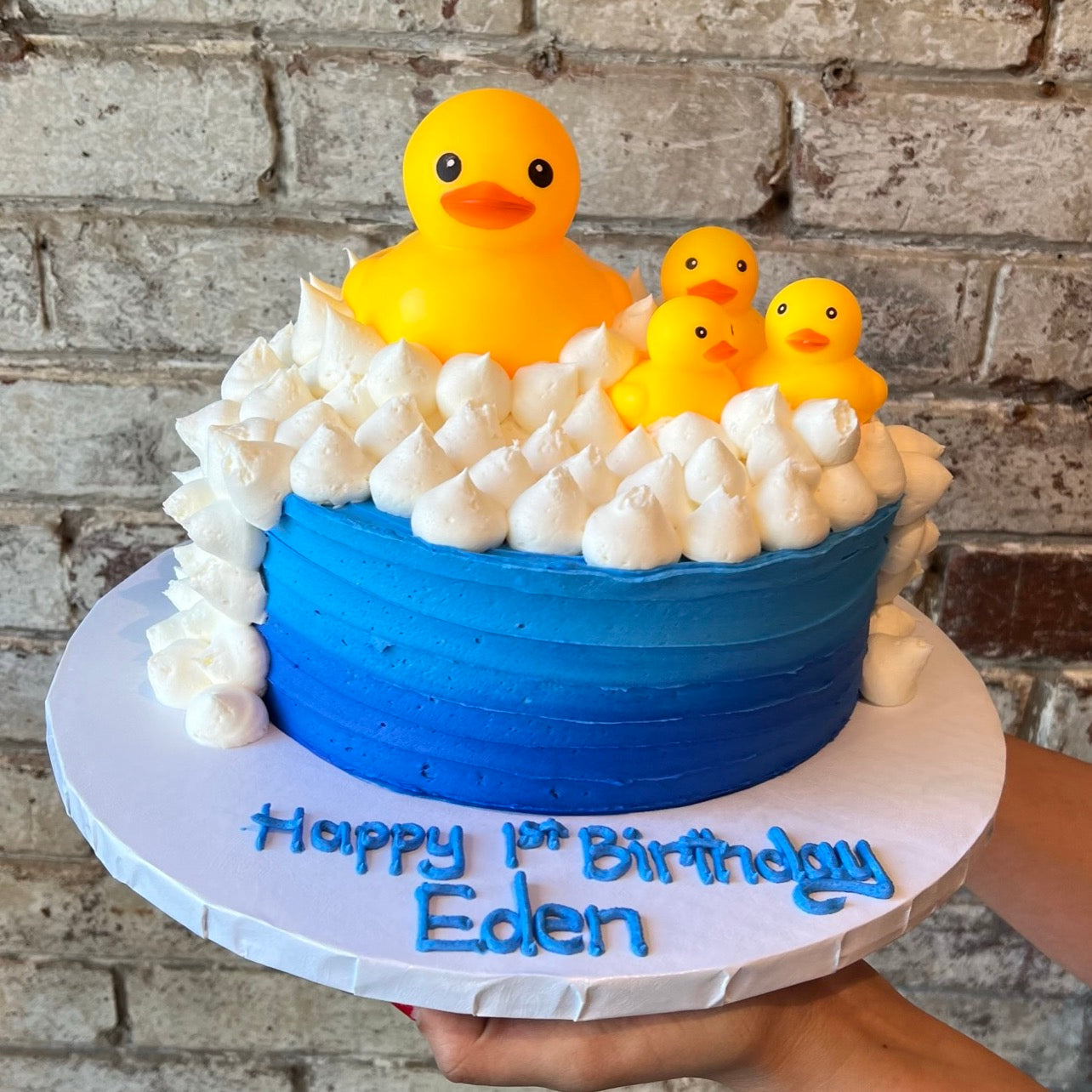 Blue with white dollars and decorative rubber duckies
