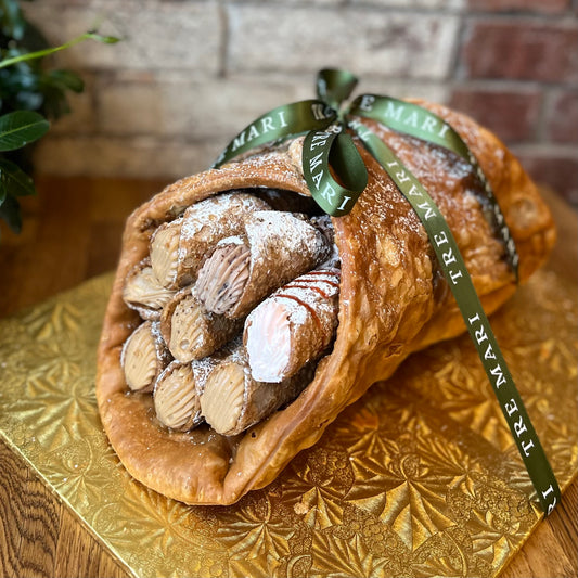 Large cannoli shell filled with smaller cannoli