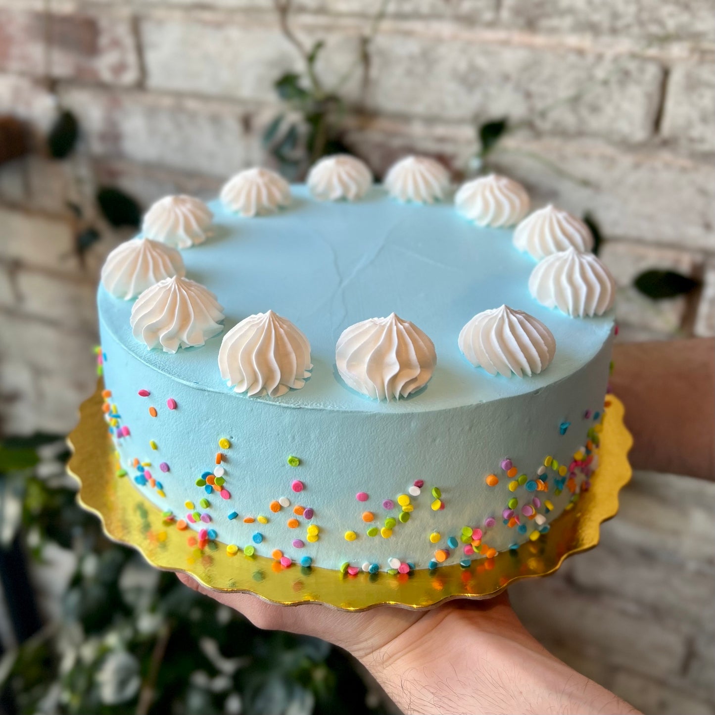 Round baby blue cake with sparkles