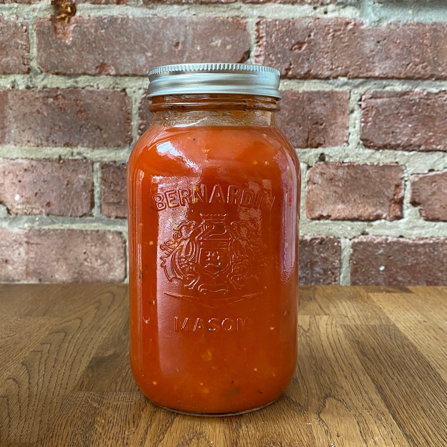 Traditional homemade tomato sauce in a mason jar