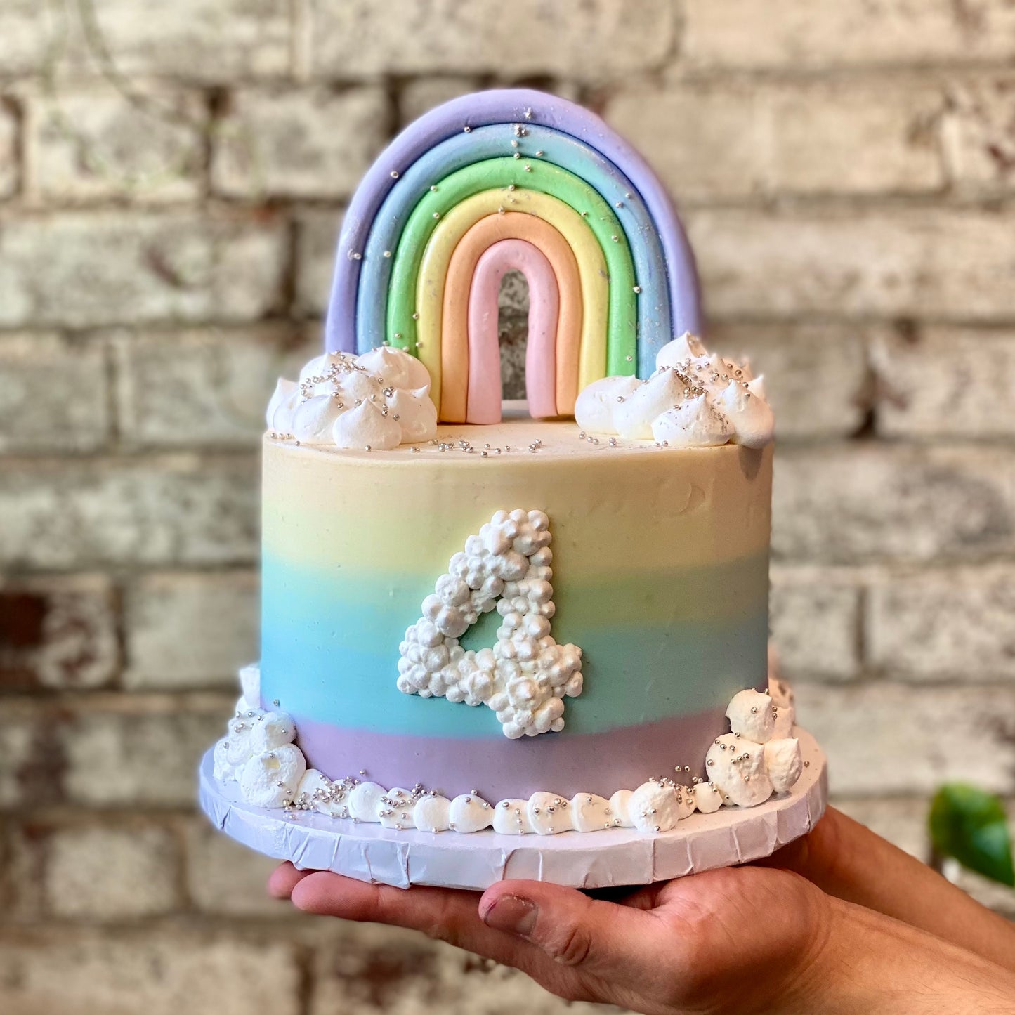 Pastel rainbow themed cake for child's birthday