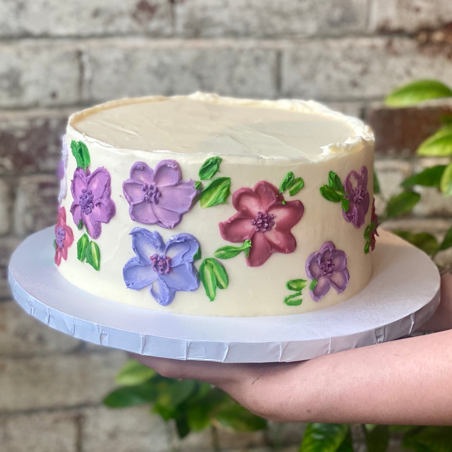 White cake with purple flowers