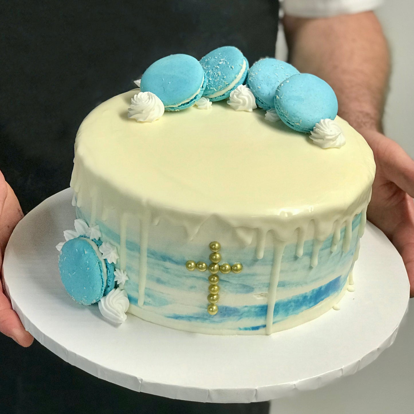 White cake religious theme and light blue macarons