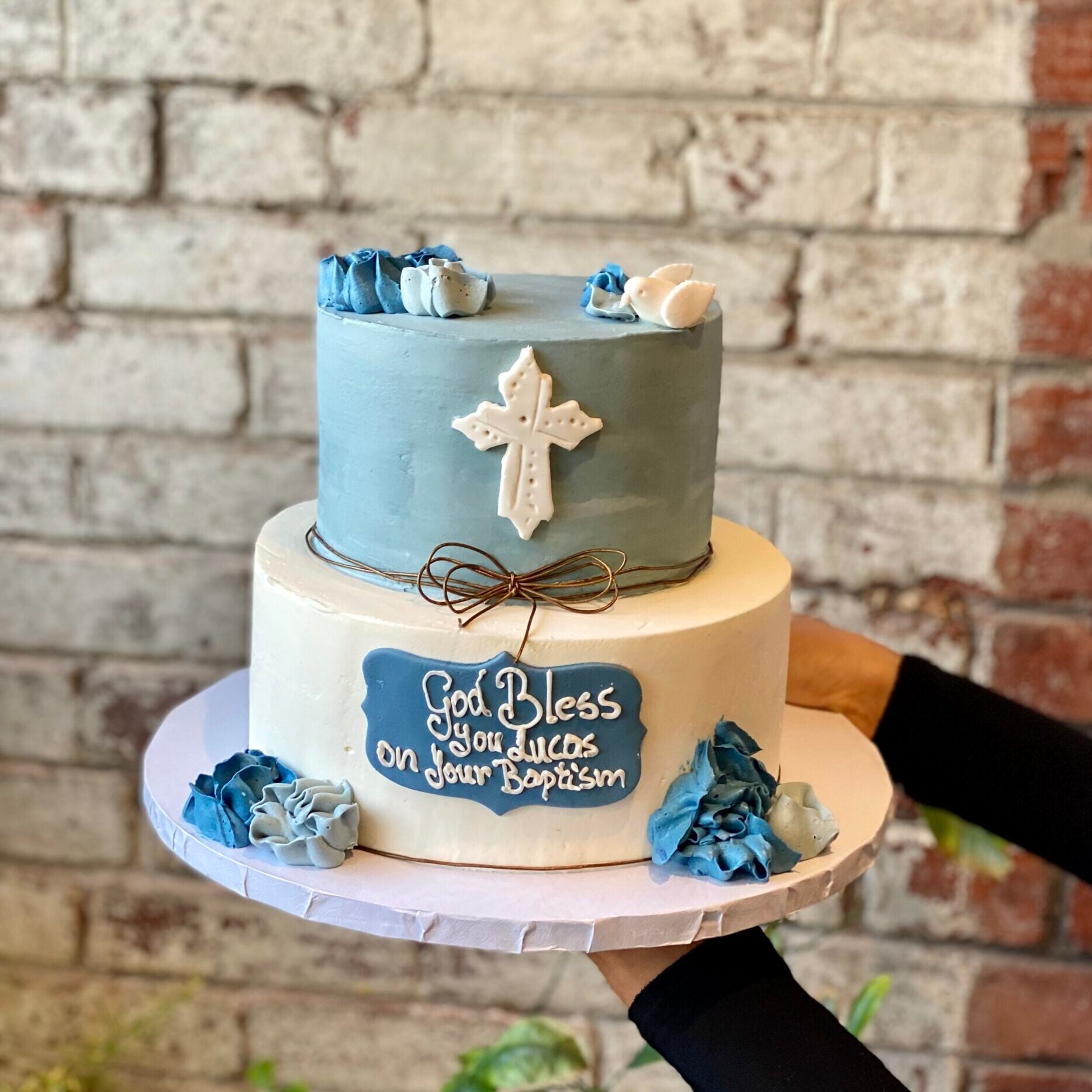 Two-tiered cake with religious theme