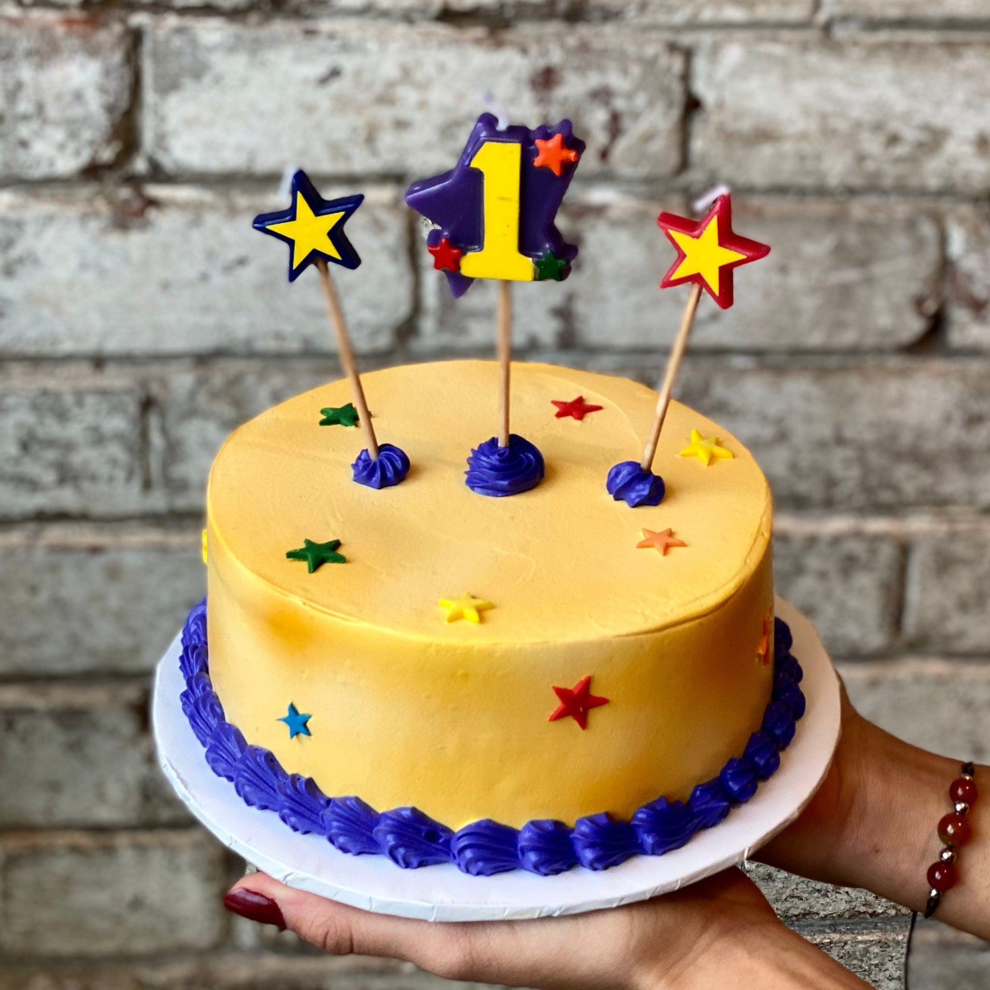 Kids birthday cake with candle of number of