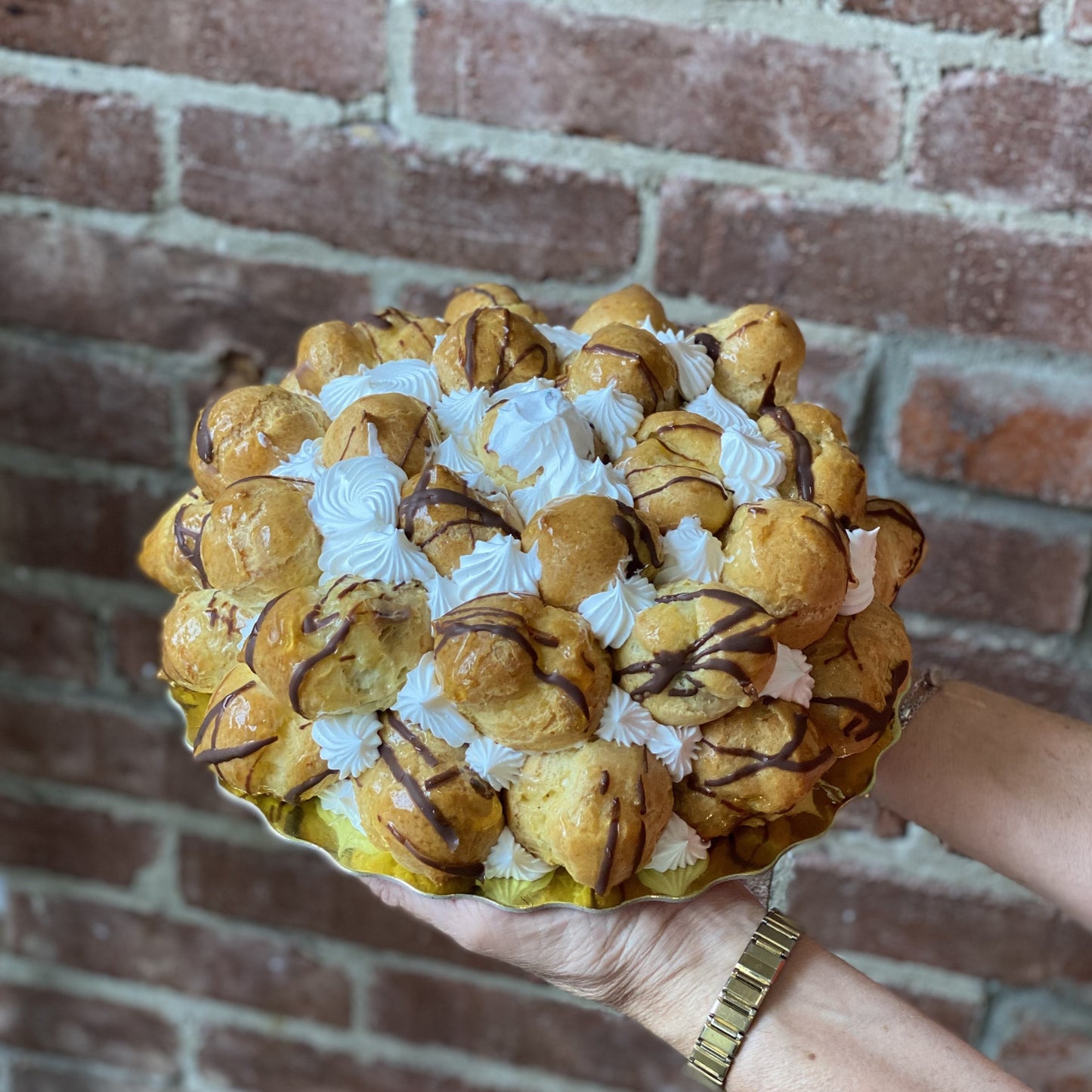 Sfoglia cake covered with St. Honore pastries